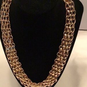 Multi strand 3-D Gold Tone chain necklace. NWT From NATASHA/DILLARDS .